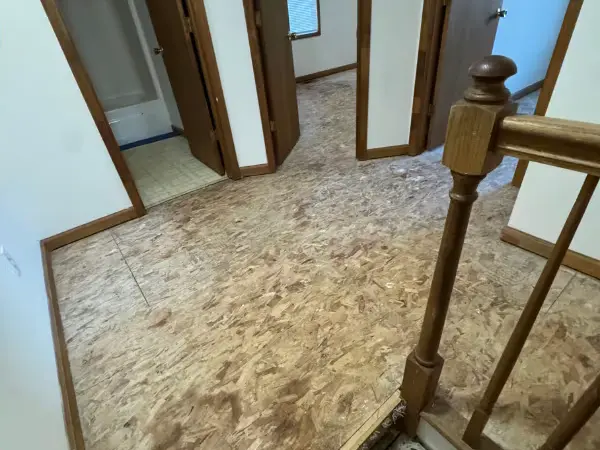 The same hallway taken back to the subfloor