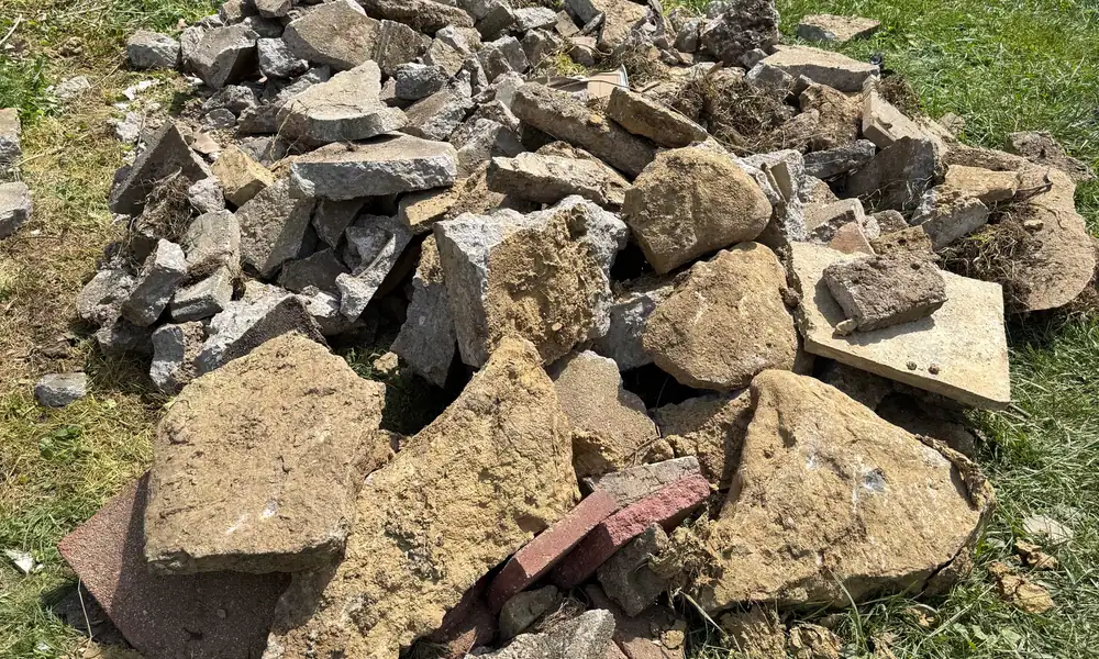 Pile of broken concrete on a lawn