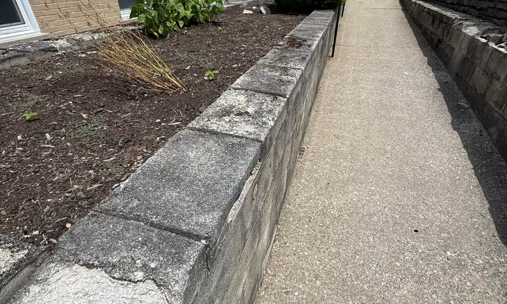 Concrete walkway between block retaining walls