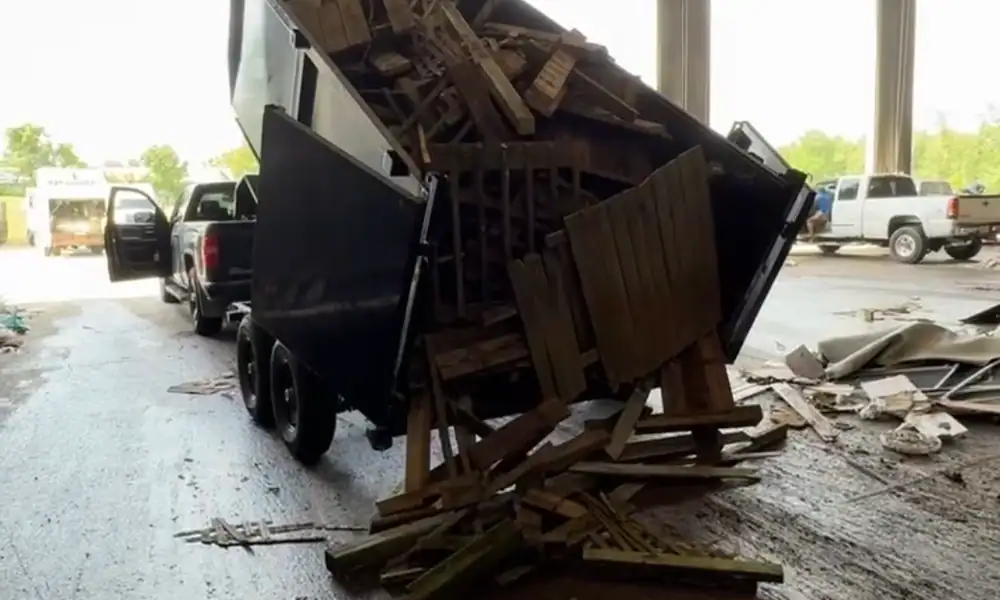 Dump trailer tipping out demolition debris