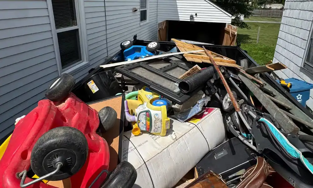 Dump trailer loaded with toys, furniture and household junk