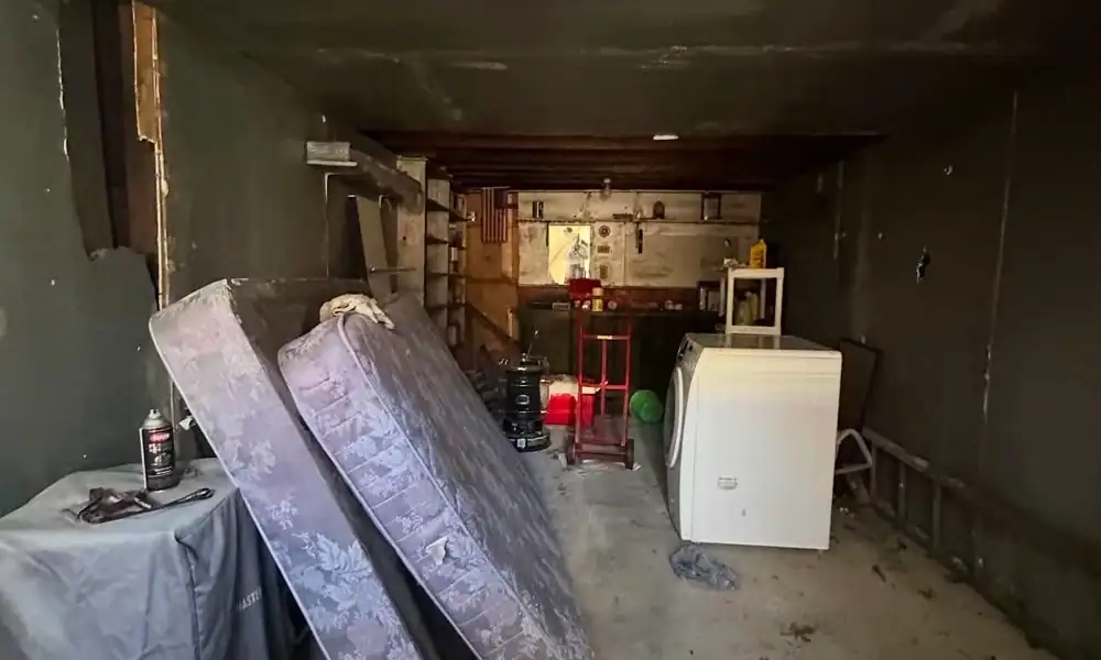 Emptied garage with old mattresses ready to go