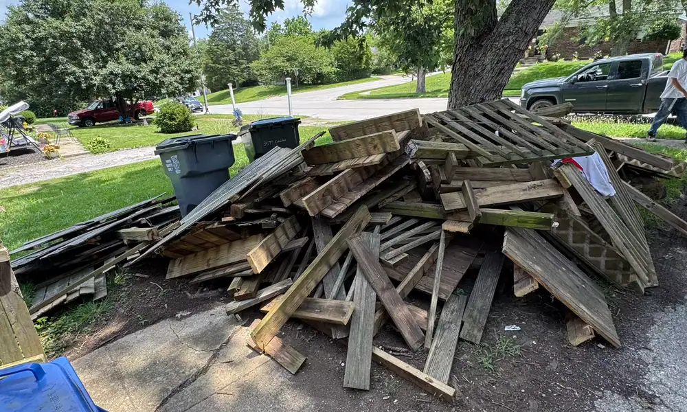 Pulled fence boards stacked for removal